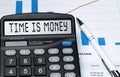 Calculator with the word TIME IS MONEY on the display Royalty Free Stock Photo