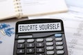 Calculator with the words EDUCATE YOURSELF on the display Royalty Free Stock Photo