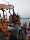 Immersion of Maa Kali under supervision of corporation officials in the Holy river Ganges , at calcutta.