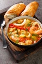 Caldeirada de frutos do mar stew with vegetables and seafood closeupin the bowl. Vertical
