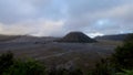 Caldera Bromo in the morning. Cloeds over volcano and smoke from crater. Timelapse Mountain Clouds