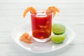 Caldo de camaron, consome de camarones, Shrimp cocktail with lemon and salted cookies mexican sea food in mexico Royalty Free Stock Photo