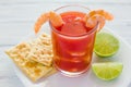 Caldo de camaron, consome de camarones, Shrimp cocktail with lemon and salted cookies mexican sea food in mexico Royalty Free Stock Photo