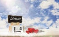 Calendar box with blackboard for entering text,February 14, love day,red heart Place on wooden table,bright blue sky background, Royalty Free Stock Photo