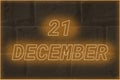 Calendar date on the background of an old brick wall. 21 december written glowing font. The concept of an important date or