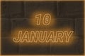 Calendar date on the background of an old brick wall. 10 january written glowing font. The concept of an important date or