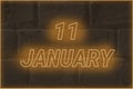 Calendar date on the background of an old brick wall. 11 january written glowing font. The concept of an important date or