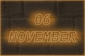 Calendar date on the background of an old brick wall. 6 november written glowing font. The concept of an important date or
