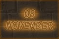 Calendar date on the background of an old brick wall. 8 november written glowing font. The concept of an important date or