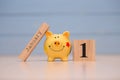 Calendar date of Financial Year start, 1st january with piggy bank on blue background. Winter time Royalty Free Stock Photo