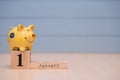 Calendar date of Financial Year start, 1st january with piggy bank on blue background. Winter time Royalty Free Stock Photo