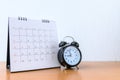 Calendar With Days and clock on wood table