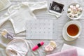 Calendar with the expected date of birth of baby, different baby clothes and ultrasound scan, pregnancy and birth concept