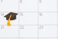 Calendar with a grad cap for your university or school graduation message Royalty Free Stock Photo