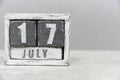 Calendar for July 17, made of wooden cubes, on gray background.With an empty space for your text.Criminal Justice Day.