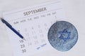 Calendar with kippah. Yom kippur concept.