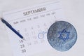 Calendar with kippah. Yom kippur concept.