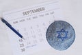 Close up view of calendar with kippah.