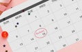 Calendar with marked Birthday date flat lying on pink background, creative collage