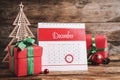 Calendar with marked Boxing Day date near gifts and decorative Christmas tree on wooden table Royalty Free Stock Photo