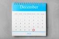 Calendar with marked date on grey stone table, top view. New Year countdown Royalty Free Stock Photo