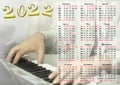 Calendar for 2022, musician hands and keys Royalty Free Stock Photo