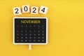 Calendar for November 2024 in black chalkboard with copy space