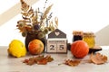 Calendar for November 25 : the name of the month in English, the number 25 , a bouquet of dried flowers in a basket, pumpkins, Royalty Free Stock Photo