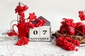 Calendar for November 7: the name of the month in English, the numbers 0 and 7, a bouquet of viburnum and viburnum branches,