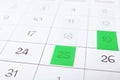 Calendar page with colorful stickers, closeup