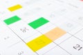 Calendar page with colorful stickers, closeup