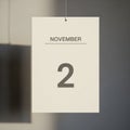 Calendar page hangs against a neutral background showing November Royalty Free Stock Photo