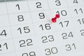 Calendar page pinned in a calendar on date business meeting schedule Royalty Free Stock Photo