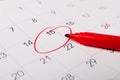 Calendar page with red pen close up. Focus on number 15 in calendar and empty red circle for design in your ideas and work concept Royalty Free Stock Photo