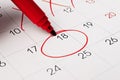 Calendar page with red pen close up. Focus on number 18 in calendar and empty red circle for design in your ideas and work concept Royalty Free Stock Photo