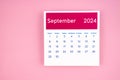 calendar page September 2024 on pink background
