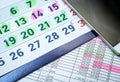 Calendar with part cell phone close up abstract