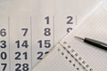 Calendar, pen and notebook with blank pages Royalty Free Stock Photo