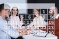 Calendar and people having business meeting in room Royalty Free Stock Photo