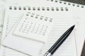 Calendar planner page on notebook list with a pen using as remin Royalty Free Stock Photo