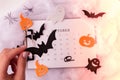 Calendar 31st of October date. Halloween background. Planning party. Flat lay. Top view. Halloween bat, pumpkin ghost