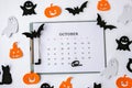 Calendar 31st of October date. Halloween background. Planning party. Flat lay. Top view. Halloween bat, pumpkin ghost