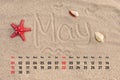 Calendar with starfish and seashells on sand beach. May 2016 Royalty Free Stock Photo