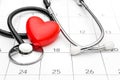 Calendar with stethoscope and red heart. Date for medical examining