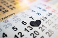 Calendar on 14th of February closed by black heart. Undivided love and broken heart Royalty Free Stock Photo