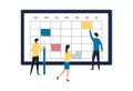 Calendar, work day planning, schedule, to-do list. Young employees make plans for the week in the electronic calendar and check