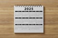 Calendar year 2025 schedule on wood table, wooden background. 2025 calendar planning appointment meeting concept. New Year. plans Royalty Free Stock Photo