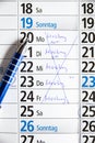 Calender with cancelled words meeting, lockdown and corona Royalty Free Stock Photo