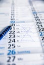Calender with cancelled words meeting, lockdown and corona Royalty Free Stock Photo
