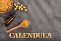 Calendula alternative medicine. Essential oil and pills - Calendula officinalis. Top view